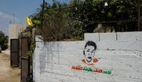 Graffiti on a wall in Nabi Saleh depicts Mohammed Tamimi.