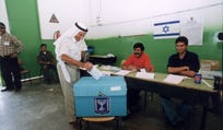 An Israeli Arab votes in the country's election.