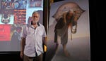 Sliman Mansour next to his "Jamal Al-Mahamel" artwork in Dubai in 2014. Credit: Reuters Artist Suleiman Mansour poses for a photograph next to his "Jamal Al-Mahamel" artwork in Dubai March 12, 2014