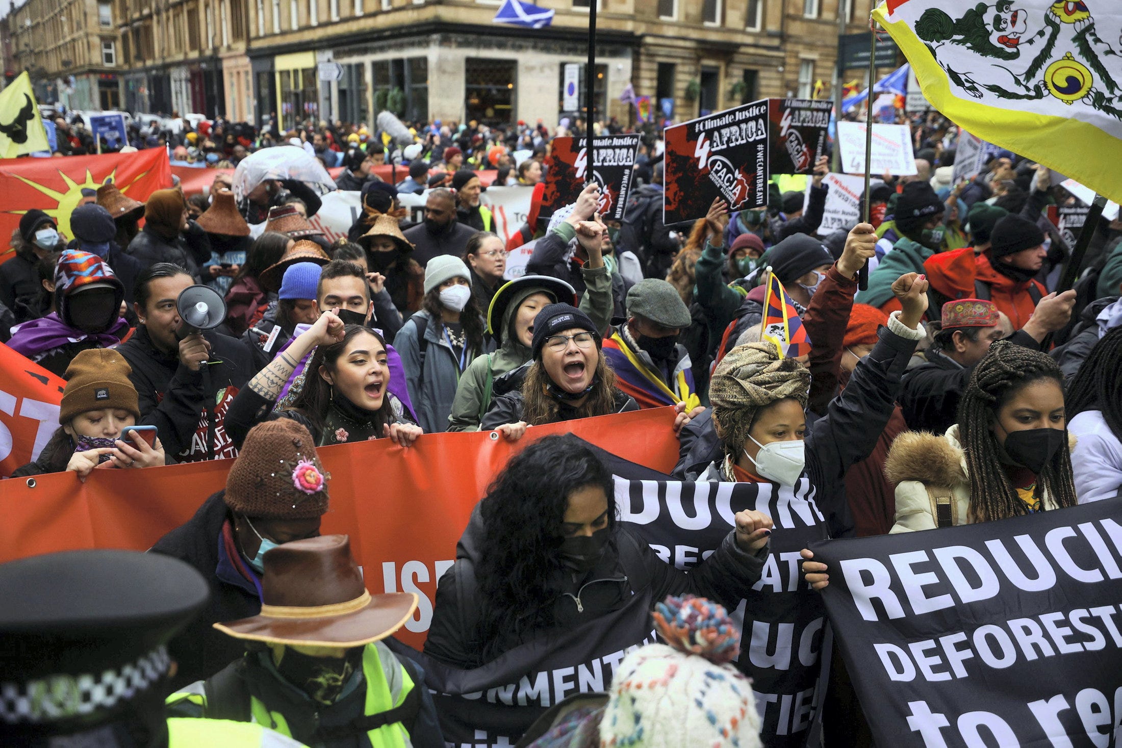Tens of Thousands Rally in Rainy Glasgow for Climate Action Amid UN ...