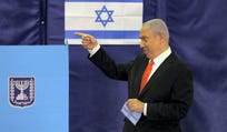 Prime Minister Benjamin Netanyahu prepares to cast his ballot in at a polling station in Jerusalem March 23, 2021.