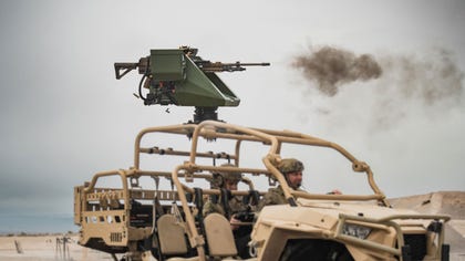 Pitbull mounted with Sig Sauer 338 MMG fires on the move from a light commando vehicle | Photograph: General Robotics