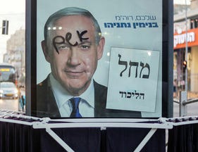 Graffiti that says "guilty" sprayed on a posters of Netanyahu, on September 2023.