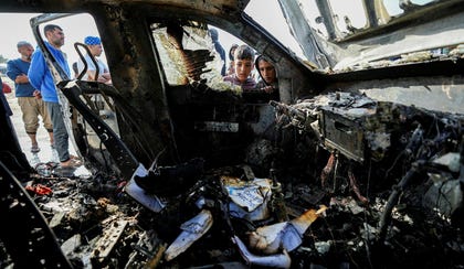 People inspect the site where World Central Kitchen workers were killed in Deir al-Balah, Gaza Strip, in April. Credit: Abdel Kareem Hana / AP People inspect the site where World Central Kitchen workers were killed in Deir al-Balah, Gaza Strip, in April.