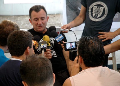 Shuki Weiss giving an interview ahead of the Rogers Water concert in 2006. Credit: Oren Levin Shuki Weiss giving an interview ahead of the Rogers Water concert in 2006.