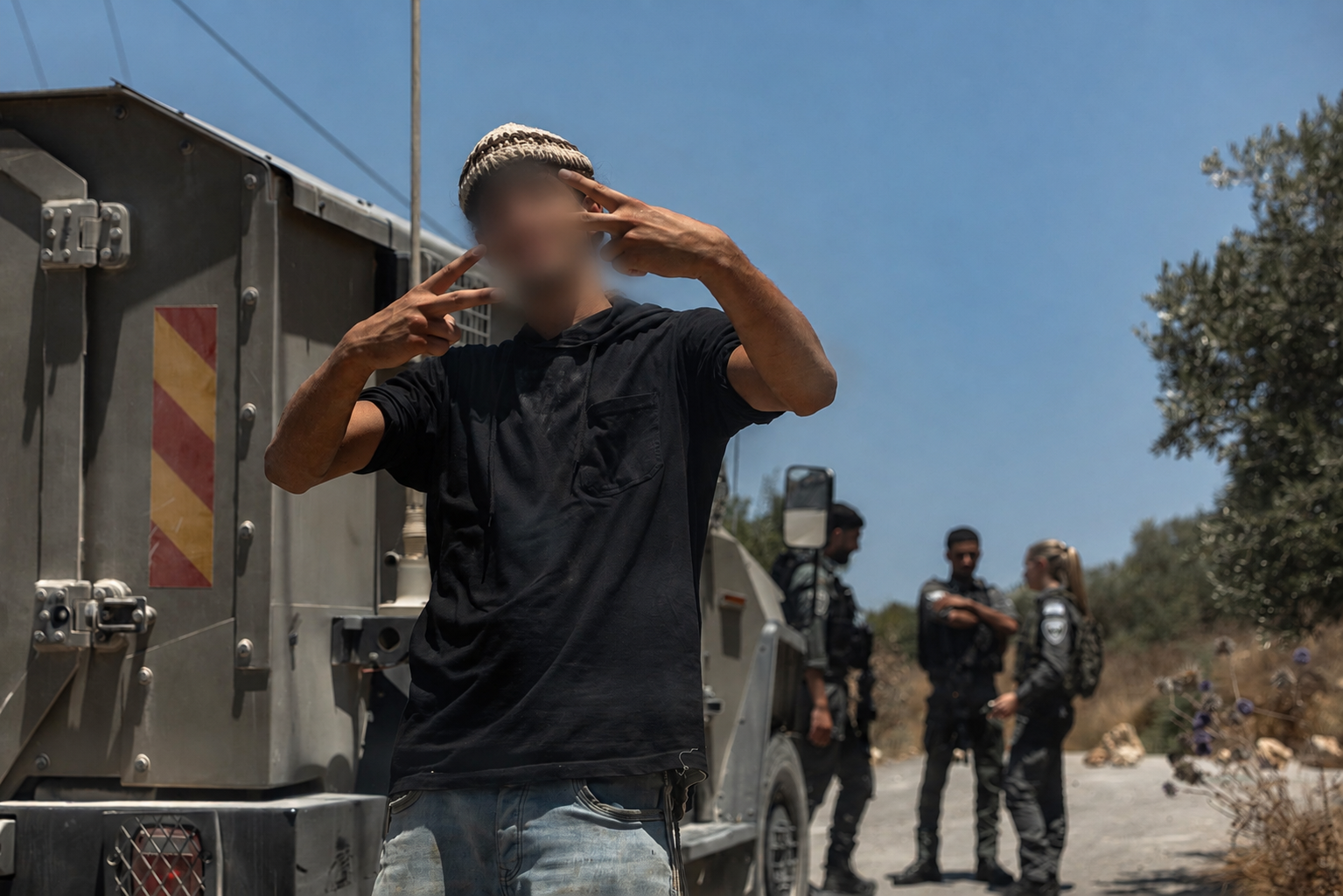 A young settler in the Palestinian village of Jalud. What makes these so-called hilltop youth so happy?