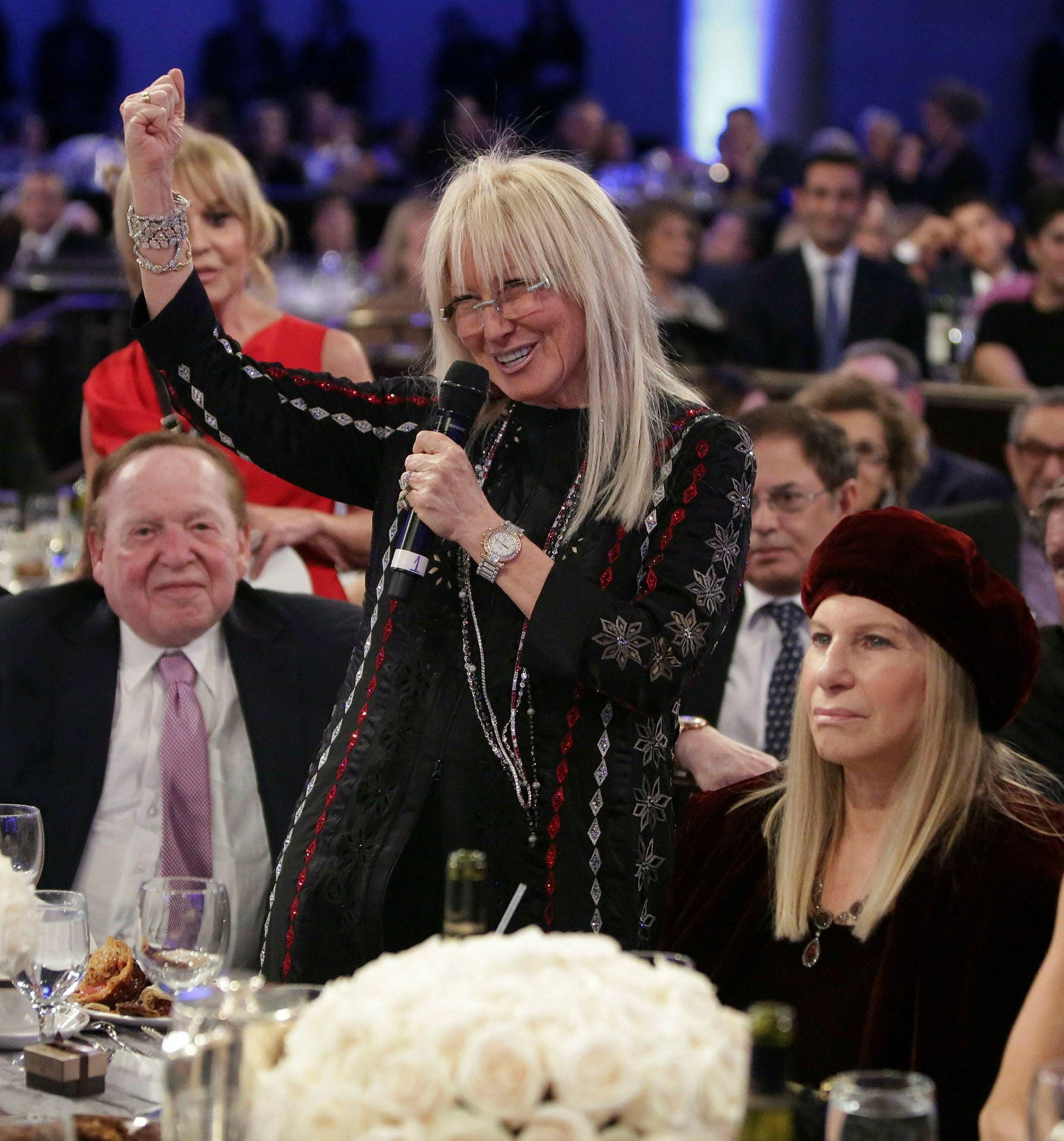 Miriam Adelson speaking at a Friends of the IDF event in Beverly Hills, California,  in 2014. "This family has been intensely meddling in Israeli politics for decades," MK Gilad Kariv wrote.