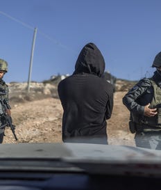 Israeli soldiers surrounding a car near the besieged Palestinian homes in Qusra, West Bank, on Monday. Credit: Itai Ron Israeli soldiers surrounding a car near the besieged Palestinian homes in Qusra, West Bank, on Monday.