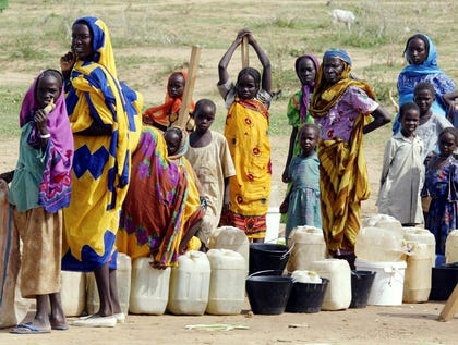 Displaced Sudanese people line up to collect water at the Brejing camp in eastern Chad in July 2024. Credit: Radu Sigheti / Reuters Displaced Sudanese people line up to collect water at the Brejing camp in eastern Chad in July 2024.
