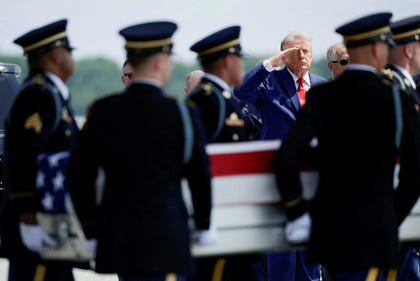 U.S. President Donald Trump salutes during a dignified transfer of the remains of U.S. Army service members killed during an attack on Muwaffaq Salti Air Base in Jordan in July.