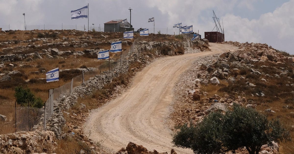 A Palestinian lies paralyzed, while the settler who shot him remains on the hill