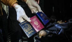 A man displaying British, Polish, and Australian passports next to the bodies of World Central Kitchen workers at Al-Aqsa Hospital in Deir al-Balah, Gaza Strip, April 2024. Credit: AFP A man displaying British, Polish, and Australian passports next to the bodies of World Central Kitchen workers at Al-Aqsa Hospital in Deir al-Balah, Gaza Strip, April 2024.