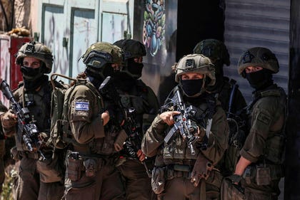 Israeli security forces patrol along a street during a military raid in the Qalandia refugee camp, south of Ramallah, earlier this month.