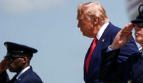 President Donald Trump disembarks from Air Force One in July at Dover Air Force Base, Del.