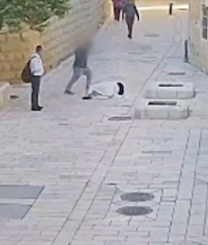 A frame from security footage showing 36-year-old Yona Schreiber assaulting a nun in Jerusalem's Old City in April.