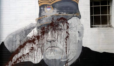 A mural of former Bosnian Serb military chief Ratko Mladic is covered in red paint in Belgrade, Serbia in 2022. Mladic died on August 27, 2026 while imprisoned at the Hague. Credit: Darko Vojinovic/AP A mural of former Bosnian Serb military chief Ratko Mladic is covered in red paint in Belgrade, Serbia in 2022. Mladic died on August 27, 2026 while imprisoned at the Hague.