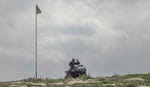 A lone settler on a tractor. Organized tours via all-terrain vehicles pass between the ruins of homes. Credit: Itai Ron A lone settler on a tractor. Organized tours via all-terrain vehicles pass between the ruins of homes.