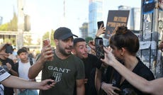 Mordechai David clashing with left-wing protesters in Tel Aviv in July.