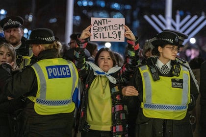 A woman holding a sign that reads "Antisemitism kills" at a solidarity vigil in London in December after the Bondi Beach Hanukkah massacre in Sydney. Credit: Thomas Krych/AP A woman holding a sign that reads "Antisemitism kills" at a solidarity vigil in London in December after the Bondi Beach Hanukkah massacre in Sydney.