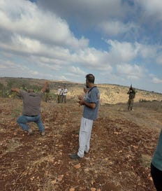A Palestinian man falls as he gets injured in the leg after Israeli soldiers intervened following Israeli militant settlers attack, locals say, near Jenin, in the West Bank, Saturday. Credit: Video Obtained by Reuters A Palestinian man falls as he gets injured in the leg after Israeli soldiers intervened following Israeli militant settlers attack, locals say, near Jenin, in the West Bank, Saturday.
