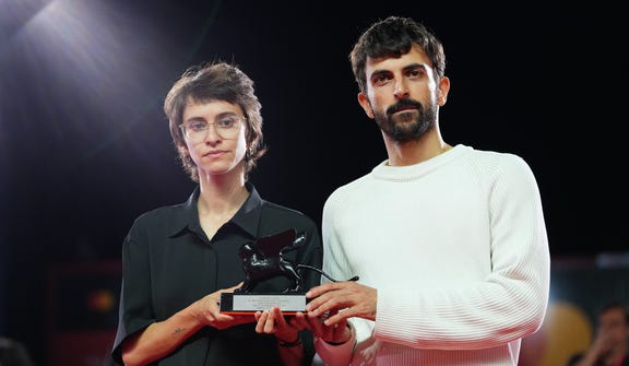 Israeli filmmakers Yuval Abraham and Rachel Szor accept the Special Jury Prize for their documentary "NAZA" at the Venice Film Festival in Venice, Italy, on Saturday. Credit: Scott A Garfitt/AP Israeli filmmakers Yuval Abraham and Rachel Szor accept the Special Jury Prize for their documentary "NAZA" at the Venice Film Festival in Venice, Italy, on Saturday.