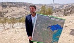 Finance Minister Bezalel Smotrich announing the E1 tender in August.