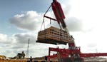 The mikveh being lifted onto a truck.