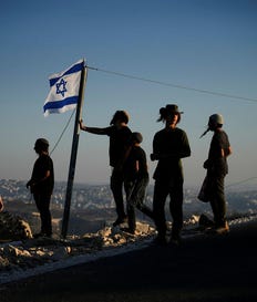 Israeli settlers gather to celebrate the inauguration of a newly built synagogue at the occupied West Bank outpost of Homesh, Wednesday. Credit: Ohad Zwigenberg/AP Israeli settlers gather to celebrate the inauguration of a newly built synagogue at the occupied West Bank outpost of Homesh, Wednesday.