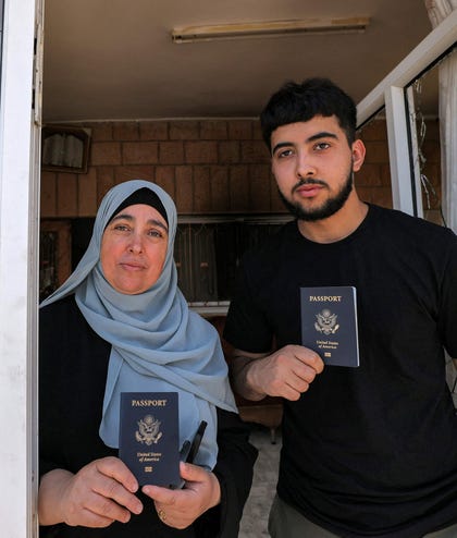 Palestinian Americans whose house was attacked during a major settler attack in June 2023 holding their U.S. passports in Turmus Ayya.