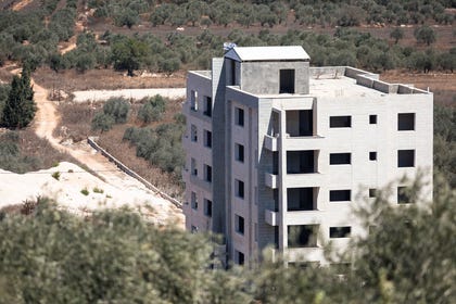The abandoned building in Turmus Ayya that was captured by settlers and now flies an Israeli flag. Credit: Itay Cohen The abandoned building in Turmus Ayya that was captured by settlers and now flies an Israeli flag.