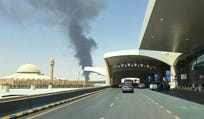 Large plume of black smoke rises from the fuel storage area at King Khalid International Airport, in Riyadh, Saudi Arabia, Saturday.