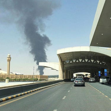 Large plume of black smoke rises from the fuel storage area at King Khalid International Airport, in Riyadh, Saudi Arabia, September