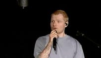 Singer Ed Sheeran speaks on stage as he addresses a controversy over Macklemore being pulled from the tour after saying "Free Palestine" at a show early this month, in Philadelphia, Pennsylvania, Saturday.