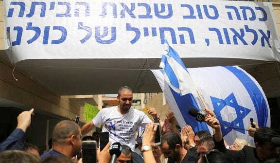 Elor Azaria meets the press upon his release from prison in 2018.