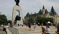 People visit the National War Memorial in Ottawa, Ontario, Canada, in August.
