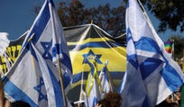 The flag superimposes the clenched fist logo of the far-right Kahanists on to the Israeli flag.
