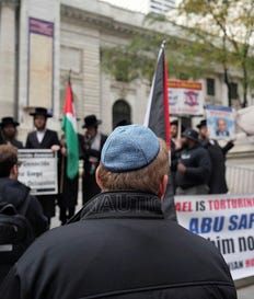 A man wearing a kippah looks at demonstrators protesting after Prime Minister Benjamin Netanyahu's address to the United Nations 81st General Assembly in New York City, U.S., September 24, 2026. Credit: David Dee Delgado/Reuters A man wearing a kippah looks at demonstrators protesting after Prime Minister Benjamin Netanyahu's address to the United Nations 81st General Assembly in New York City, U.S., September 24, 2026.