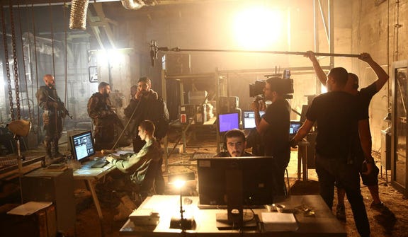 A crew films a scene on the set of Israel's hit TV show "Fauda," in Tel Aviv. Credit: Oded Balilty / AP A crew films a scene on the set of Israel's hit TV show "Fauda," in Tel Aviv.