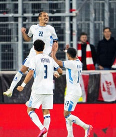 Israel's players celebrate during last Thursday's match against Austria. Credit: AFP/Georg Hochmuth Israel's players celebrate during last Thursday's match against Austria.