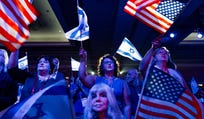 A crowd of mostly Evangelical Christians waves U.S. and Israeli flags during a Christians United For Israel (CUFI) event in Washington.