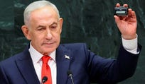 Israeli Prime Minister Benjamin Netanyahu holds up a pager as he addresses the 81st United Nations General Assembly (UNGA) at UN headquarters in New York City, US, September 24, 2026.   REUTERS/Mike Segar