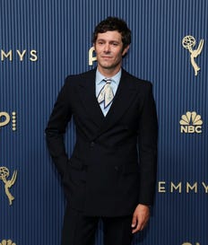 Adam Brody walks the red carpet at the 78th Emmy Awards in Los Angeles, earlier this month.