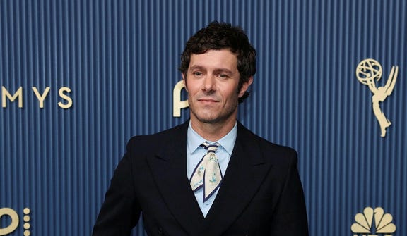 Adam Brody walks the red carpet at the 78th Emmy Awards in Los Angeles, earlier this month.