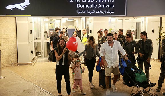 Passengers arriving at Ben Gurion Airport following the suspected hijacking of a flydubai flight from Dubai to Israel, Wednesday.