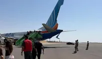Flydubai airplane with broken wing at the Tabuk airport in Saudi Arabia, on Wednesday.