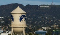 The Paramount Pictures water tower is seen in Los Angeles, in December, with the Hollywood sign in the distance.