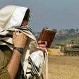 An Israeli soldier praying near the border with Lebanon.