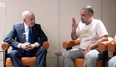 Israeli PM Netanyahu meets Yaniv Hayun, a passenger on the flydubai flight which was diverted to Saudi Arabia following an attempted hijacking. Netanyahu met Hayun, who helped take down the attacker, at Ben-Gurion airport after landing.