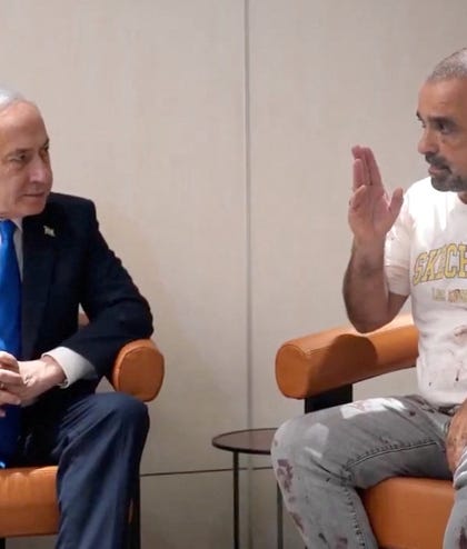 Israeli PM Netanyahu meets Yaniv Hayun, a passenger on the flydubai flight which was diverted to Saudi Arabia following an attempted hijacking. Netanyahu met Hayun, who helped take down the attacker, at Ben-Gurion airport after landing.