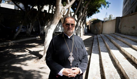 Father Constantine at St. George's Church in Jaffa Saturday. Credit: Moti Milrod Father Constantine at St. George's Church in Jaffa Saturday.